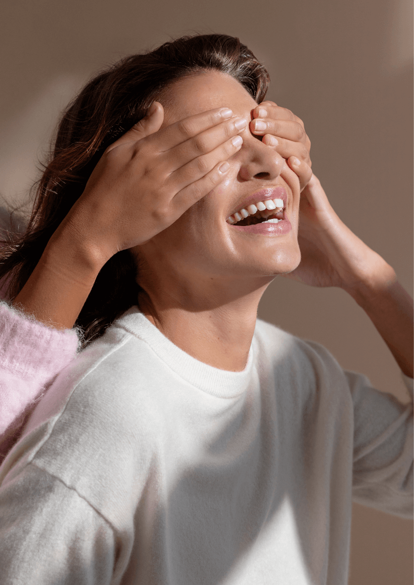 An image of a model laughing